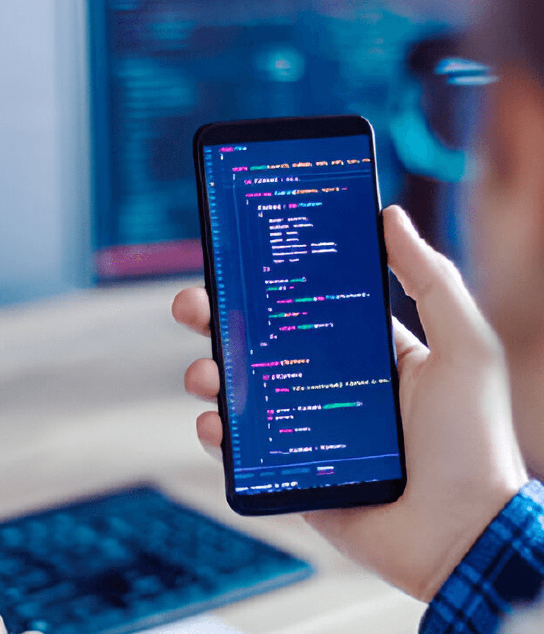 Android mobile phone in hand with code on screen