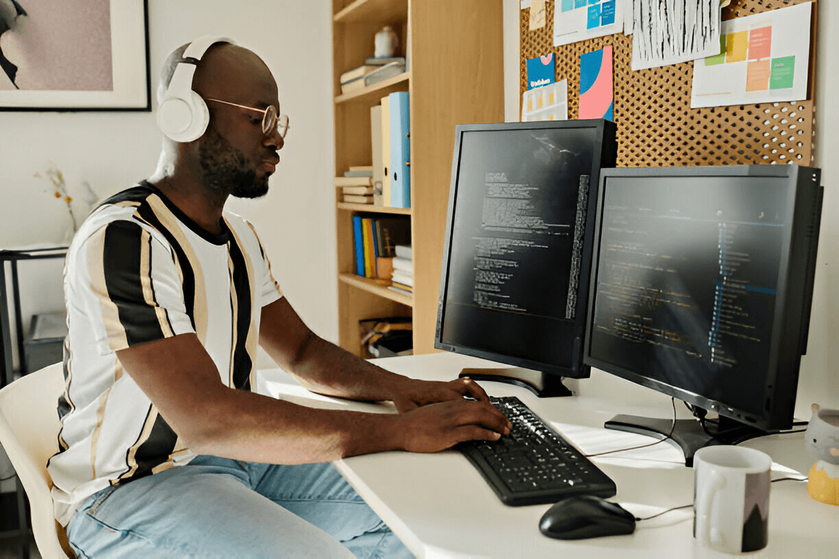 Man Writing code on computer